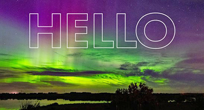 Northern lights photo with Hello over it